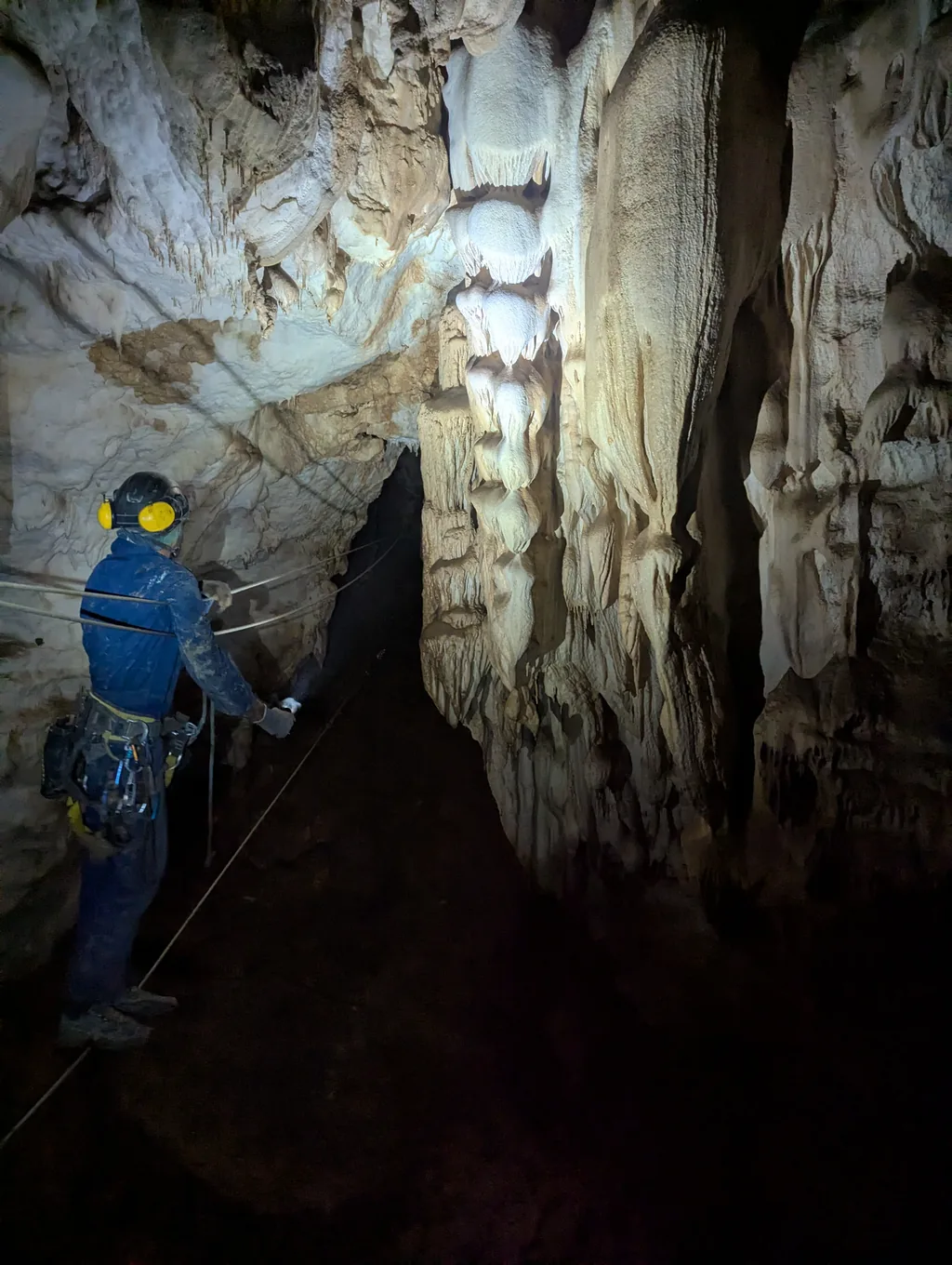 Rope access technician working in a cave