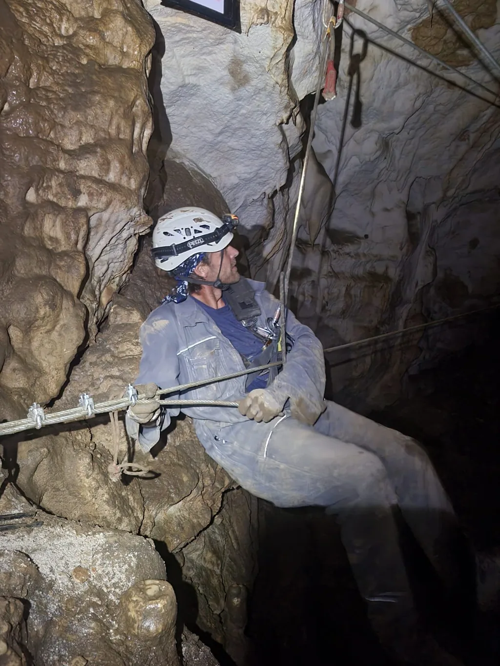 Rope access technician working in a cave