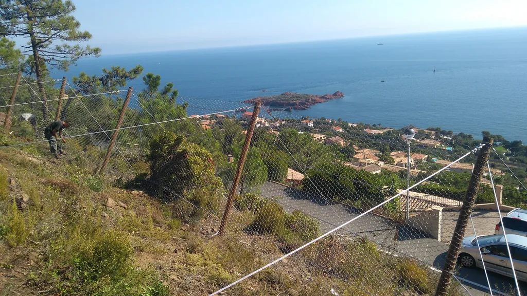 Protective barrier on a slope overlooking the sea