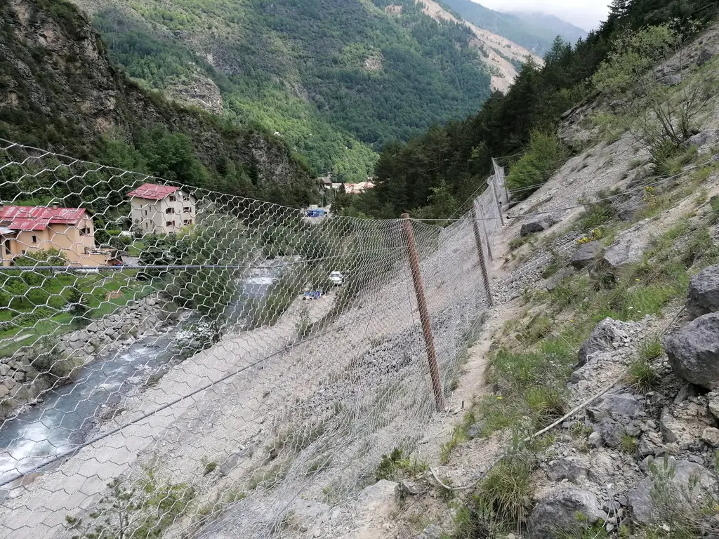 Rockfall barrier in a mountain valley