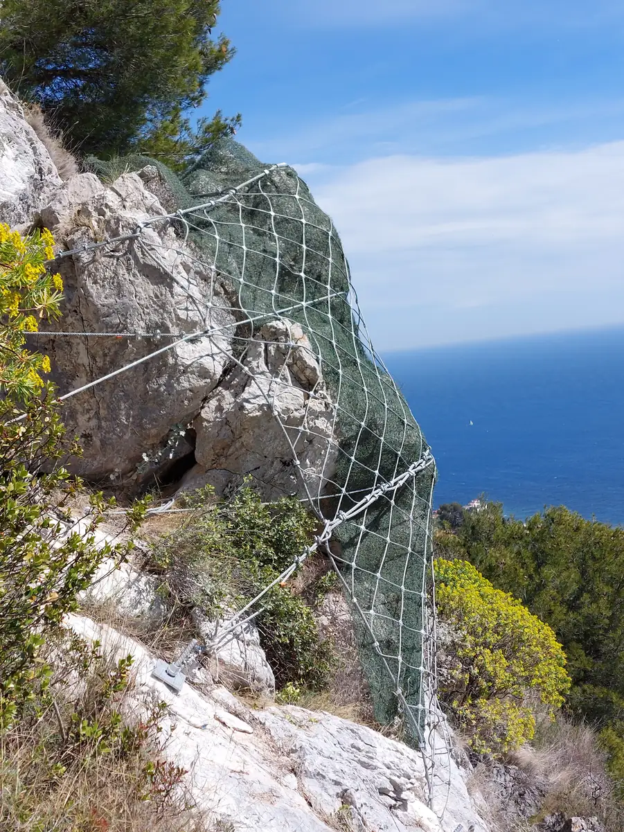 Pinned mesh on a seaside cliff