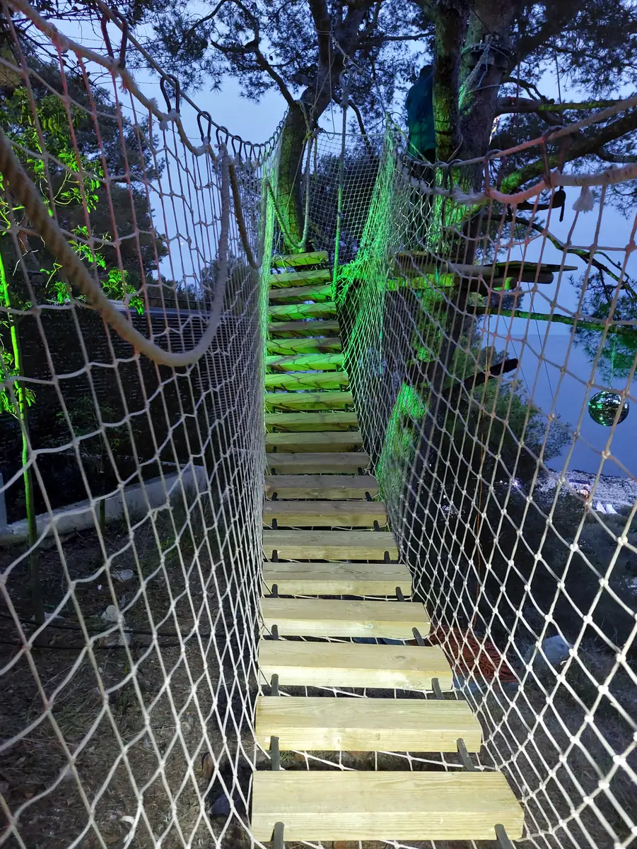 Net walkway lit up at night