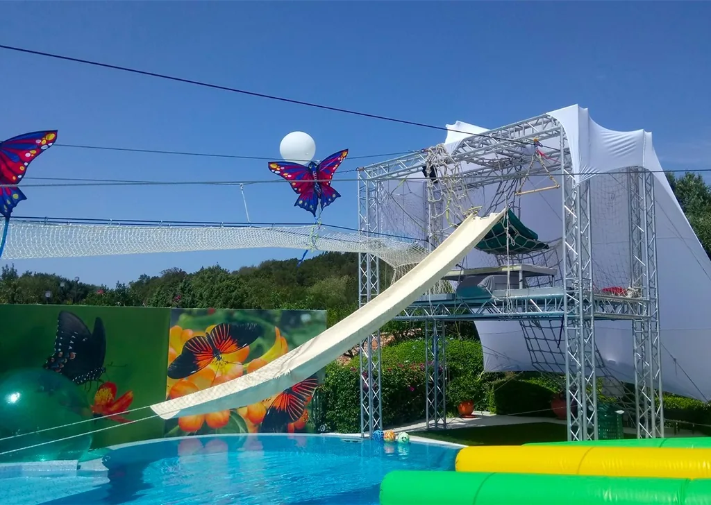 Pool zip line and slide set up for a birthday party, Sardinia